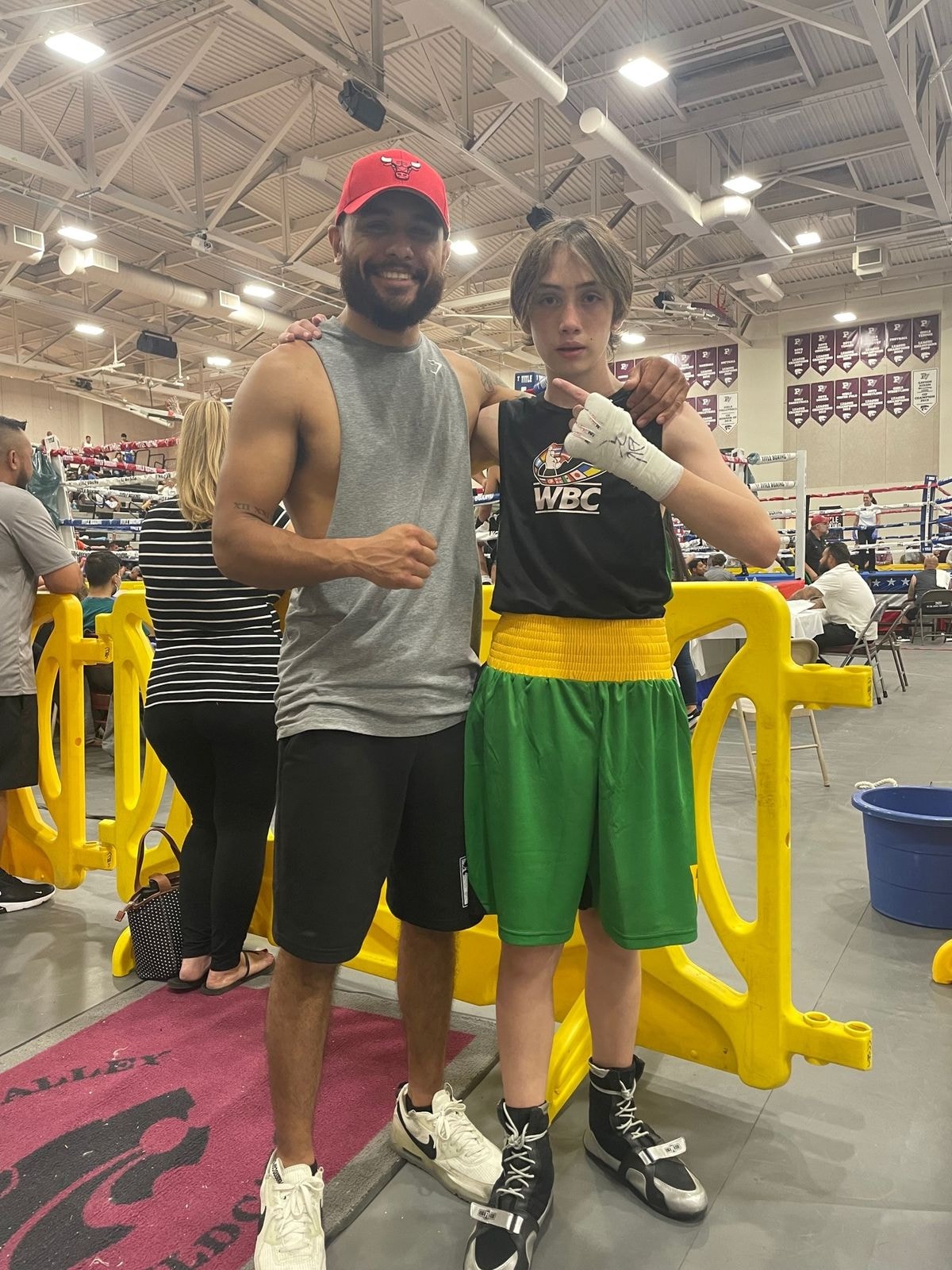 Coach training youth boxer